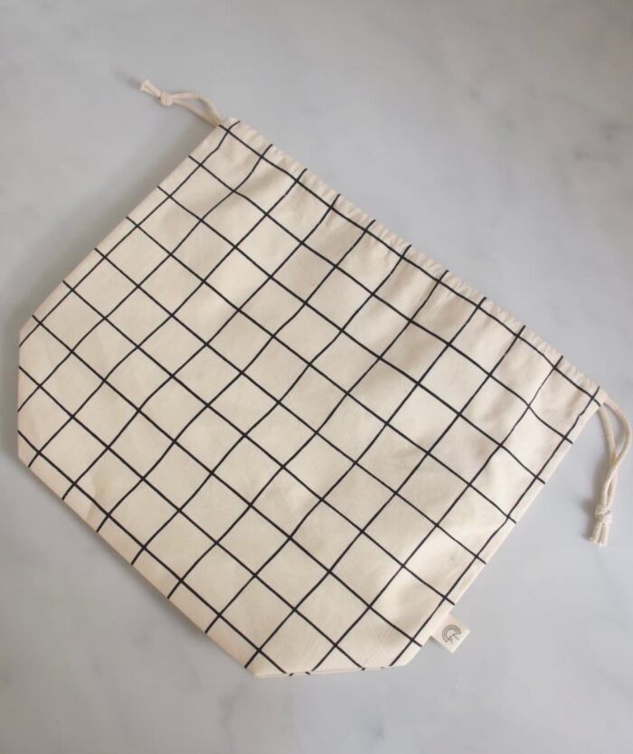 La Sache à Pains de Casavida à plat, sac à pain réutilisable en coton à carreaux avec cordon